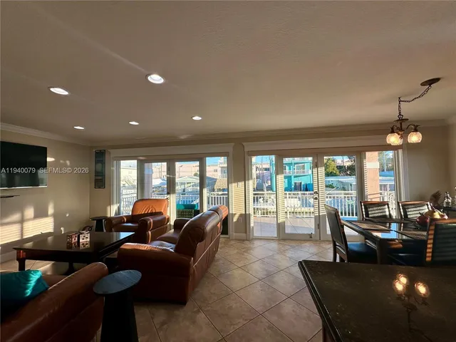 a large kitchen with a table and chairs