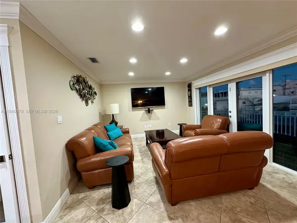 a bedroom with a bed and a flat tv screen