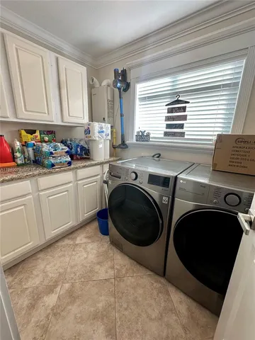 a spacious bathroom with a toilet sink and mirror