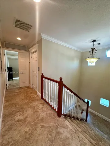a spacious bedroom with a bed and glass door