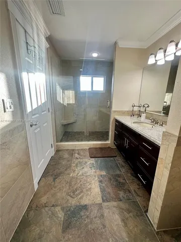 an aerial view of a house with roof deck and outdoor seating