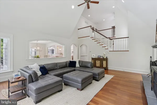 a living room with furniture or couch and a ceiling fan