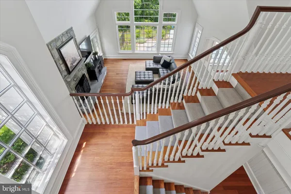 a view of entryway with wooden floor and stairs