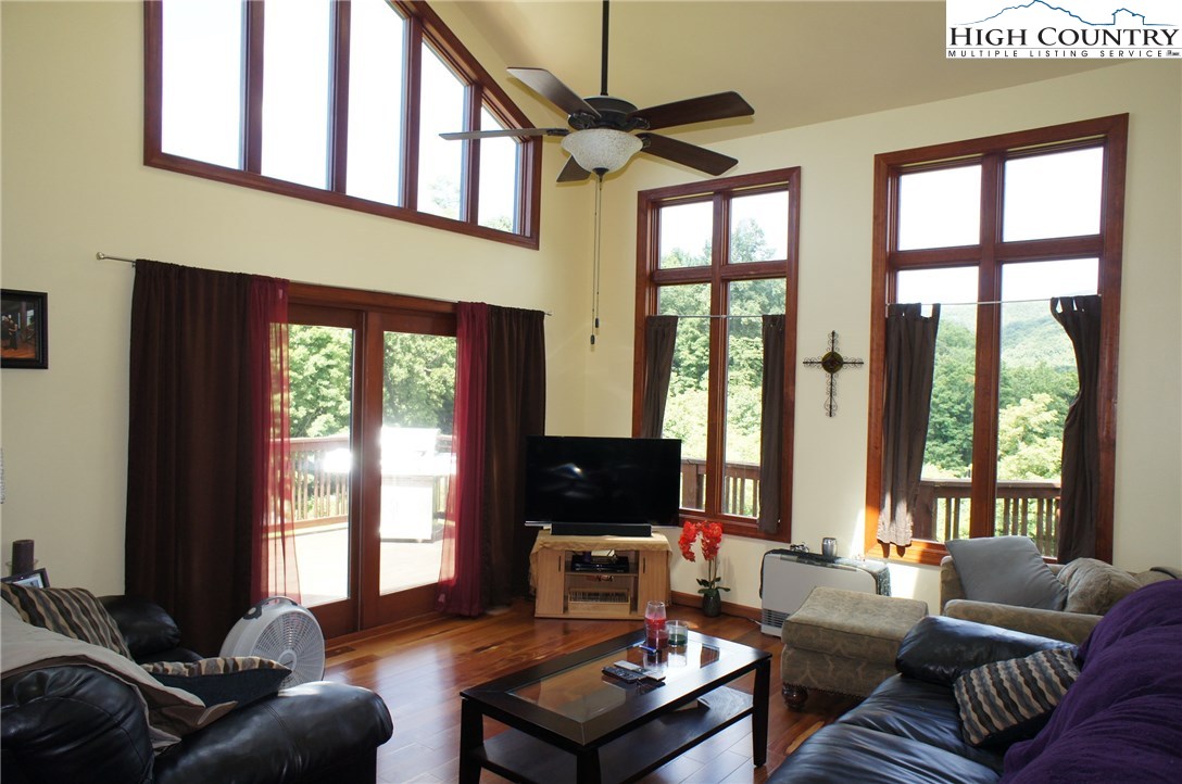 1339 Hopewell Church Road Boone, NC 28607 - Photo 19 of 35 a living room with furniture ceiling fan and a window