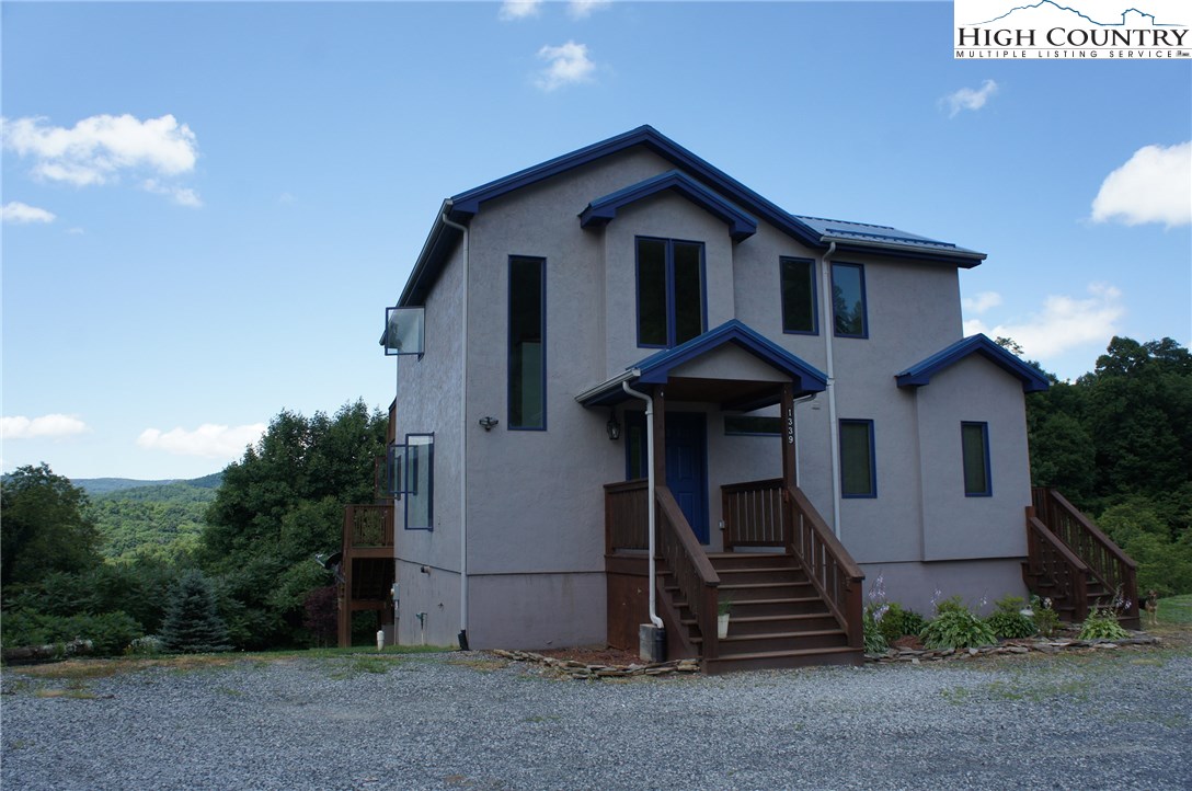1339 Hopewell Church Road Boone, NC 28607 - Photo 2 of 35 a front view of a house with a yard