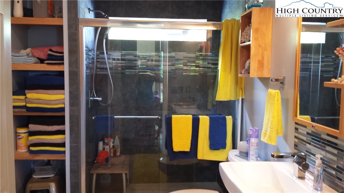1339 Hopewell Church Road Boone, NC 28607 - Photo 25 of 35 a bathroom with a sink and a mirror