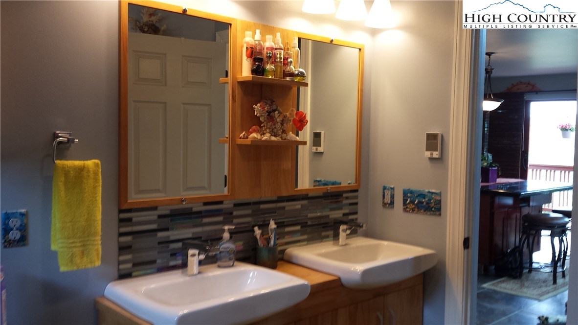 1339 Hopewell Church Road Boone, NC 28607 - Photo 26 of 35 a bathroom with a sink and a mirror