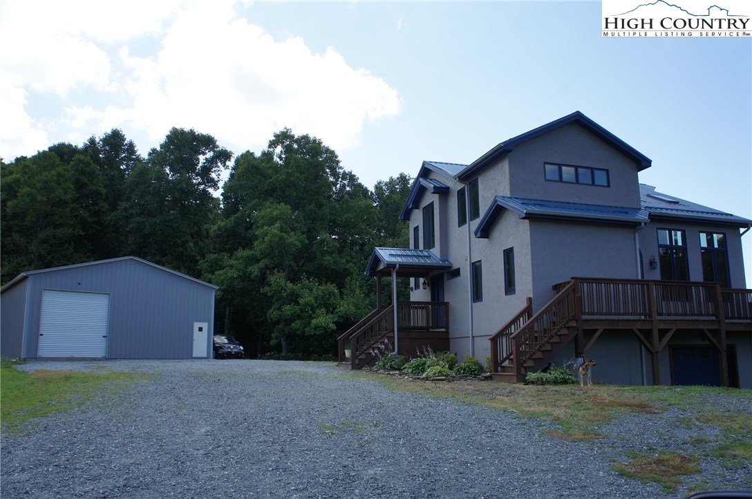 1339 Hopewell Church Road Boone, NC 28607 - Photo 5 of 35 a front view of a house with garden