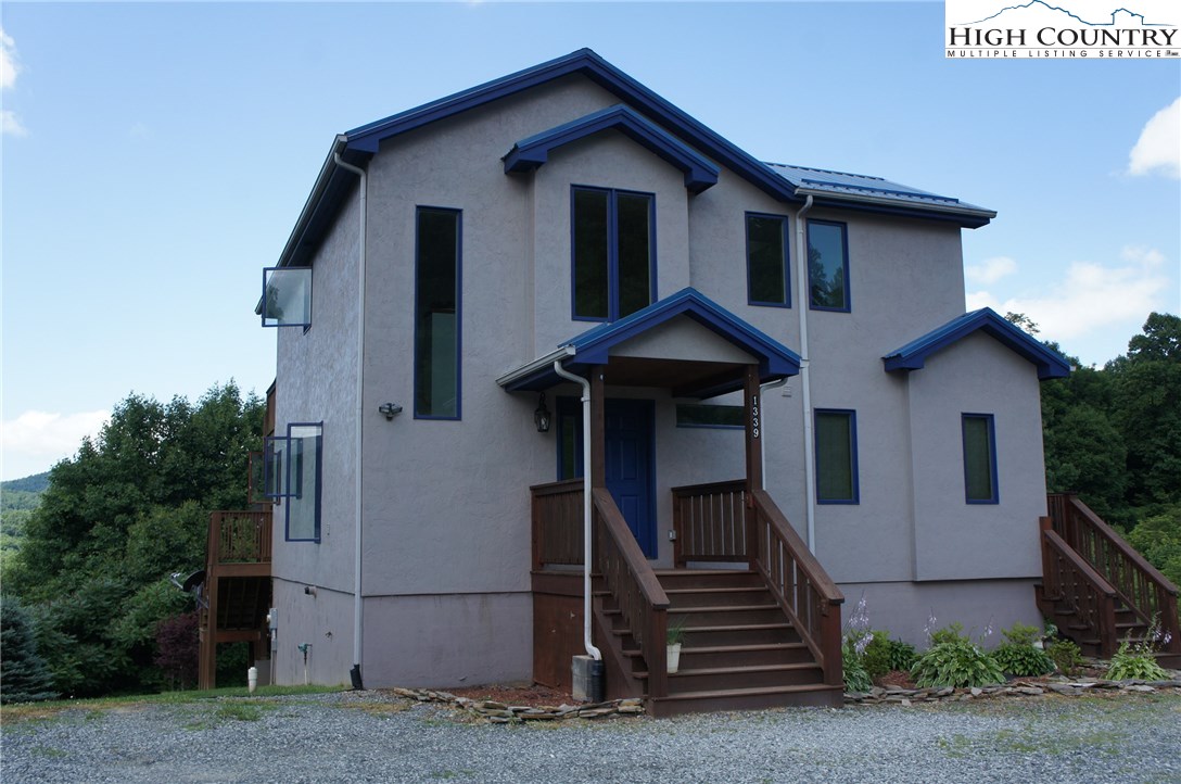 1339 Hopewell Church Road Boone, NC 28607 - Photo 6 of 35 a front view of a house with stairs