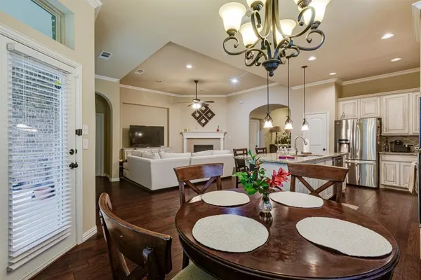 a kitchen with a table and chairs