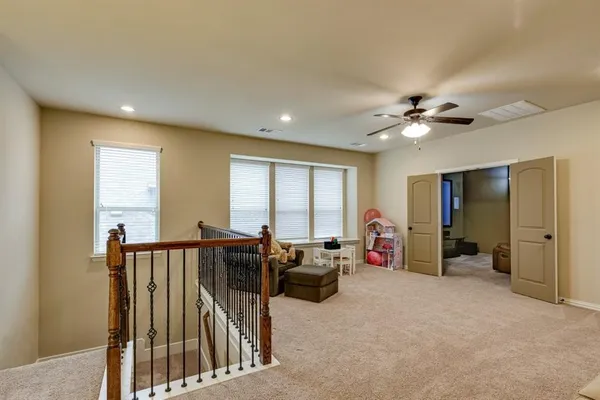 a view of a livingroom with furniture and windows