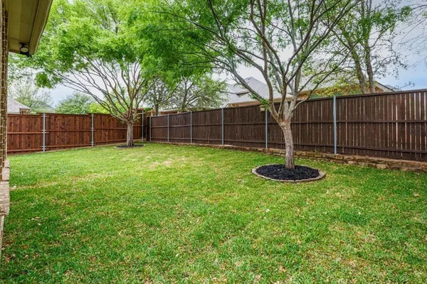 a view of a backyard with a swing