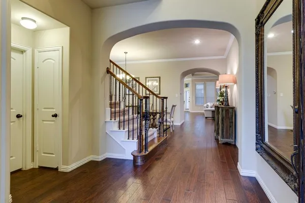 a view of gallery with wooden floor