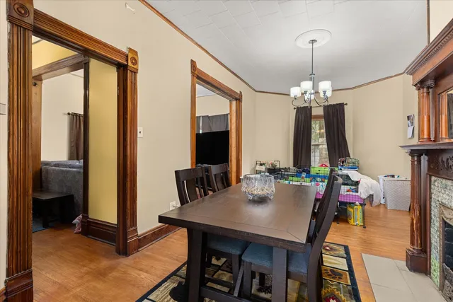 a view of a dining room with furniture and a chandelier