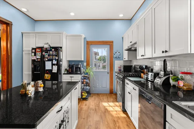 a kitchen with lots of counter top space and cabinets