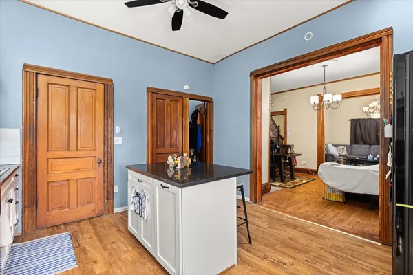 a very nice looking room with a large window and wooden floor