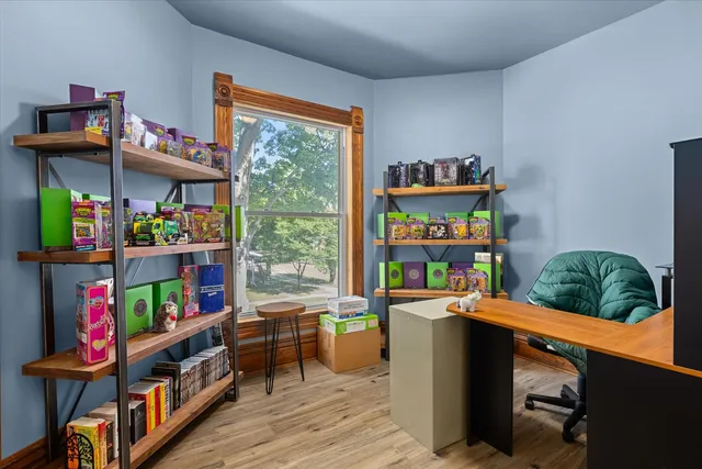 a room with lots of furniture and a window