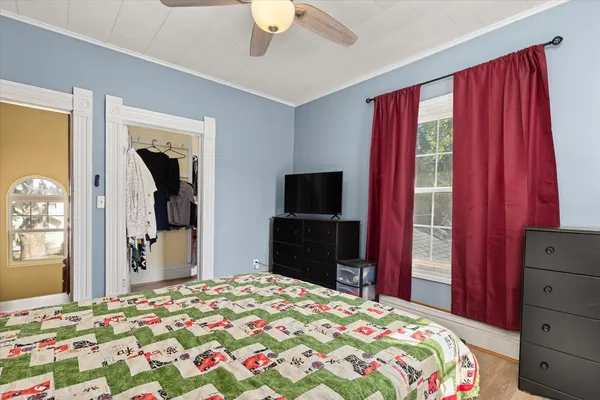 a bedroom with a bed and a dresser