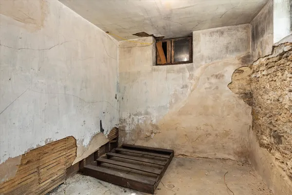 a backyard of a house with outdoor seating