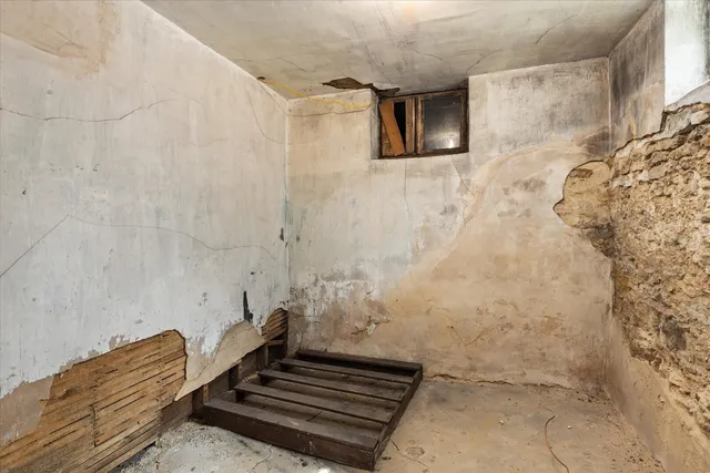 a backyard of a house with outdoor seating