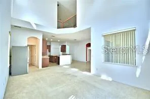 a view of a hallway with a kitchen