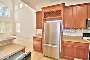 a kitchen with a refrigerator and a sink