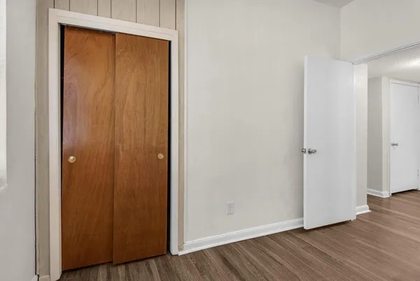a view of an entryway with wooden floor