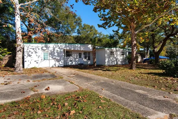 a view of a yard with cars