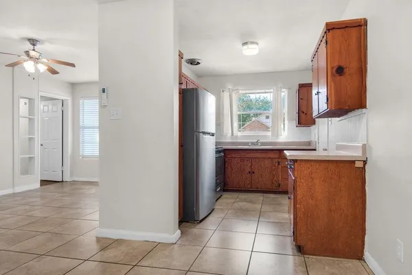 a kitchen with a sink a counter top space and appliances