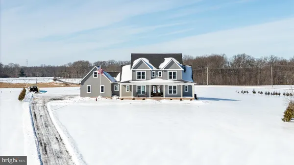 a view of a house with a yard and roof