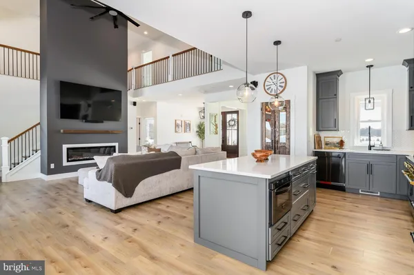 a living room with furniture fireplace and flat screen tv