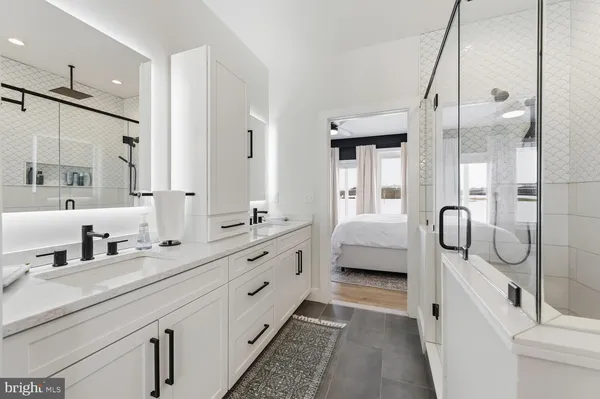 a bathroom with a toilet a sink and a mirror