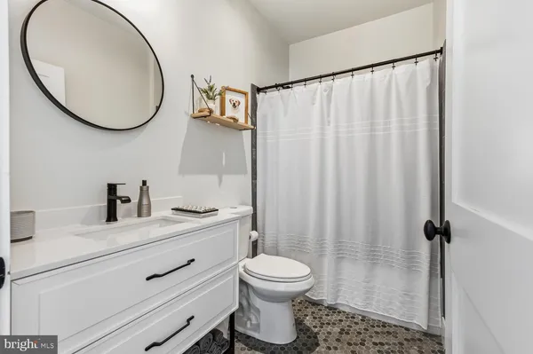 a view of hallway with wooden floor