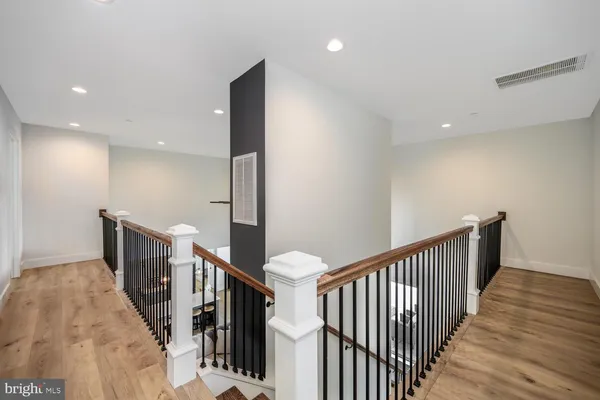 a bedroom with a bed ceiling fan and a window