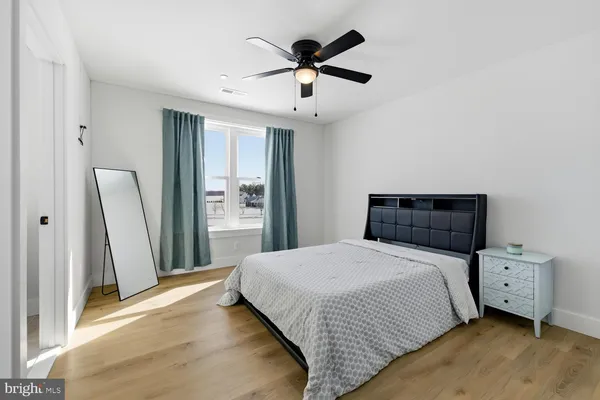 a bedroom with bed and a window