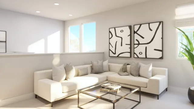 a living room with furniture a potted plant and a wooden floor