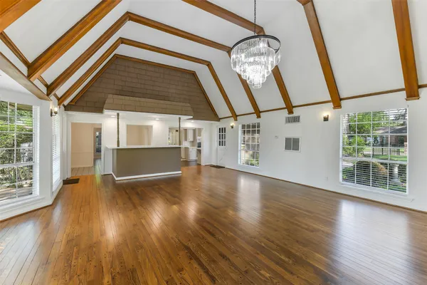 a view of an entryway with wooden floor