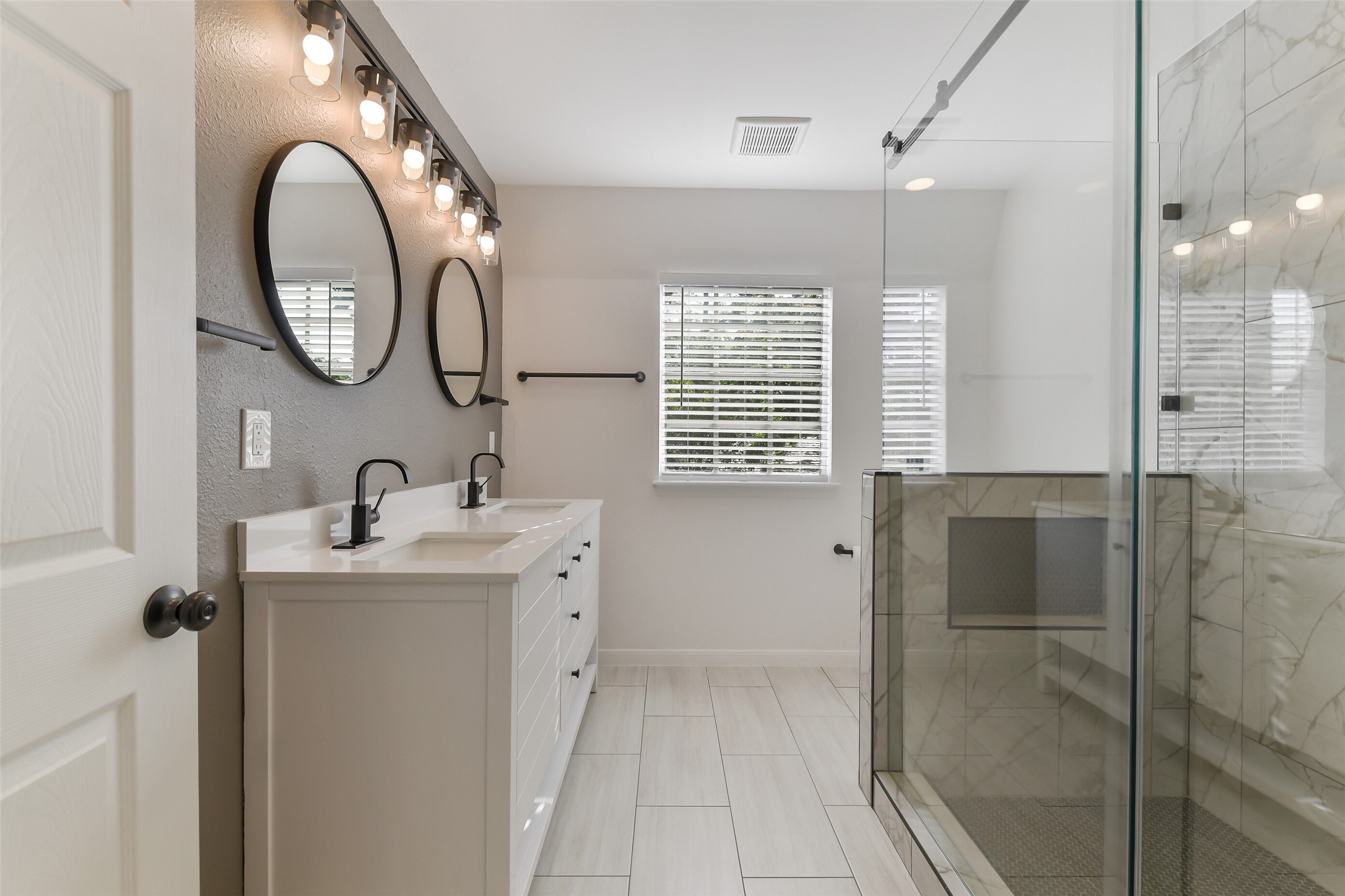 13103 Coral Ridge Court Houston, TX 77069 - Photo 22 of 43 a bathroom with a sink and a mirror