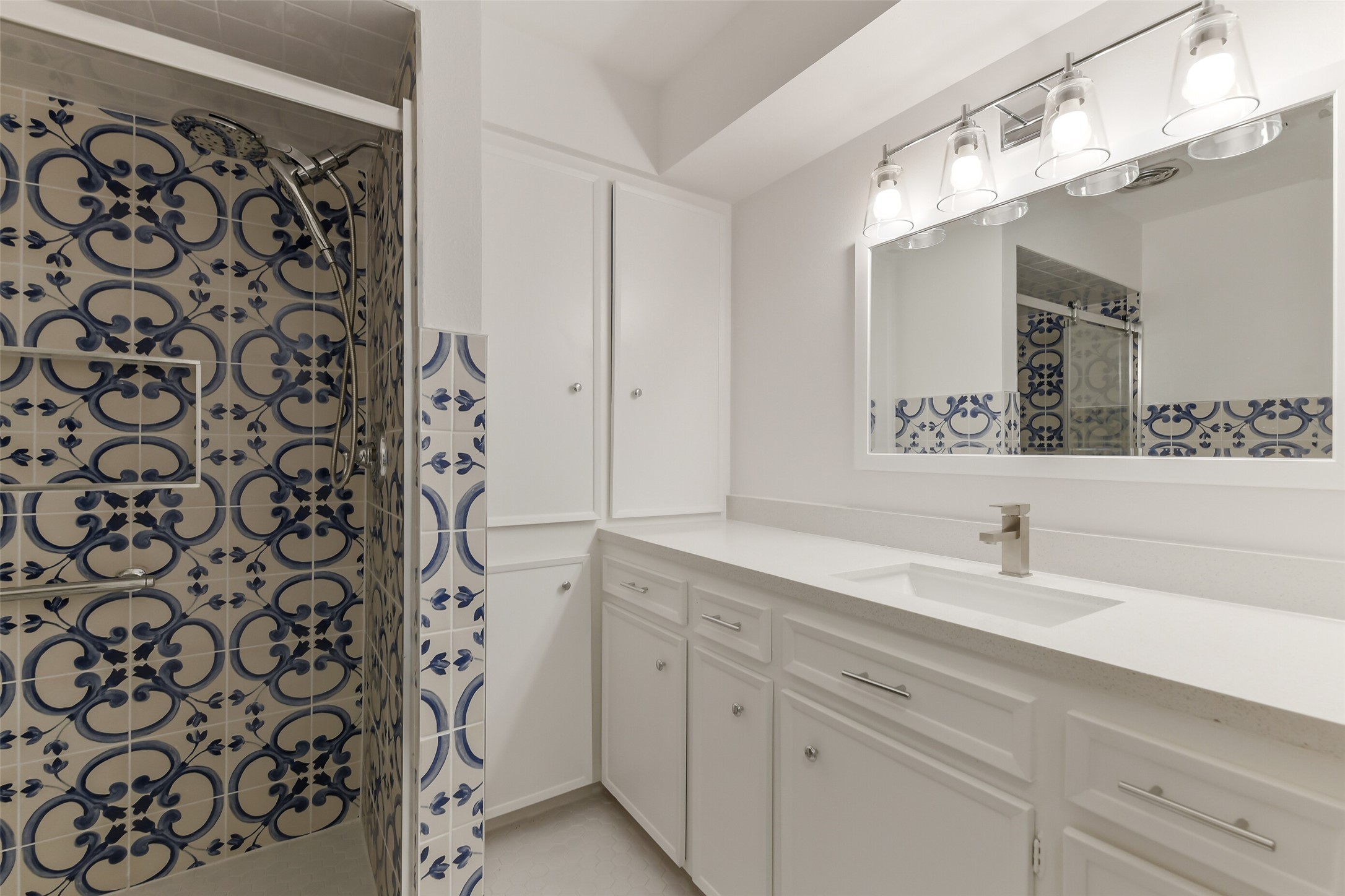 13103 Coral Ridge Court Houston, TX 77069 - Photo 30 of 43 a bathroom with a sink and a mirror