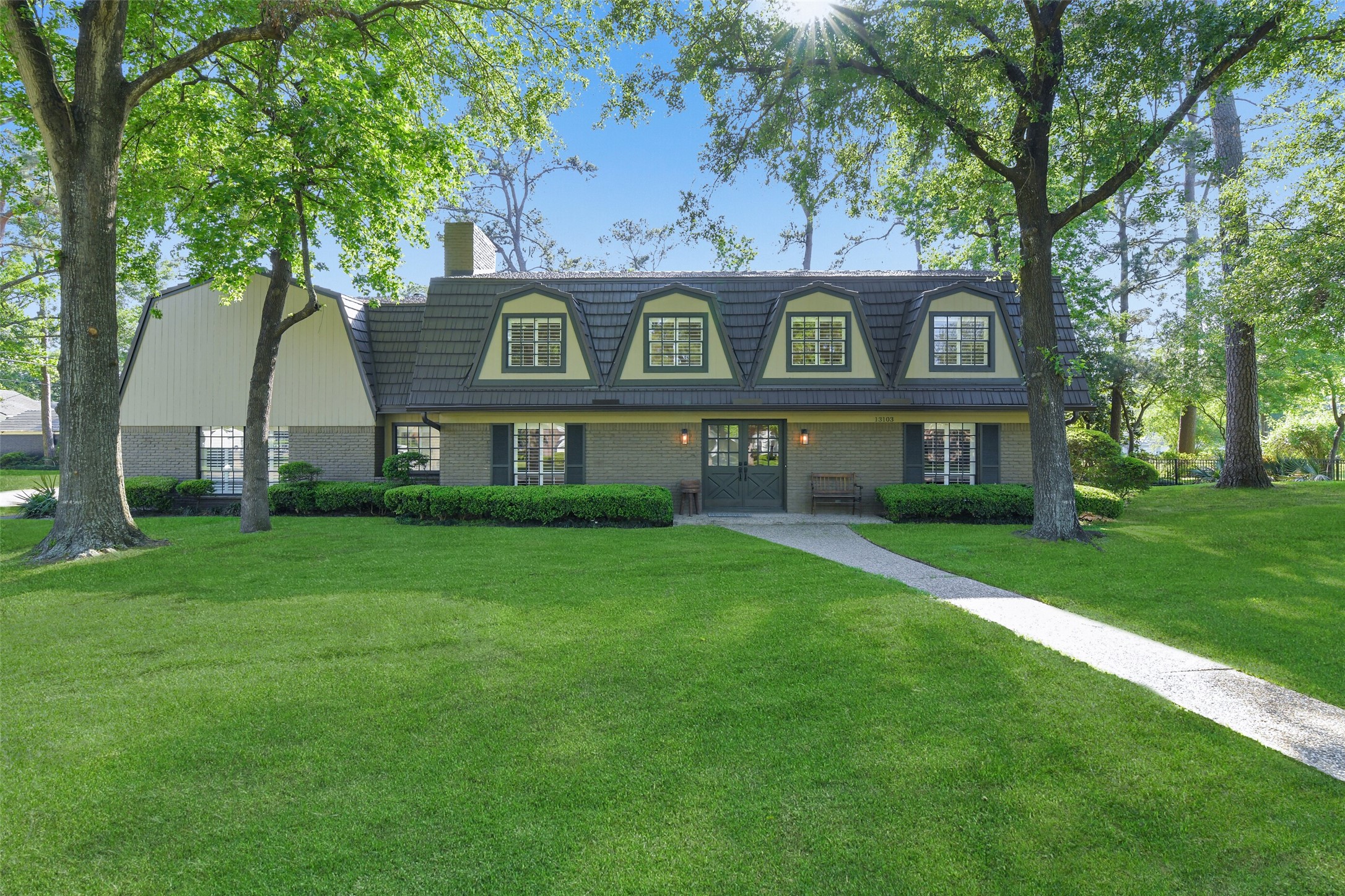 13103 Coral Ridge Court Houston, TX 77069 - Photo 38 of 43 a front view of a house with a garden