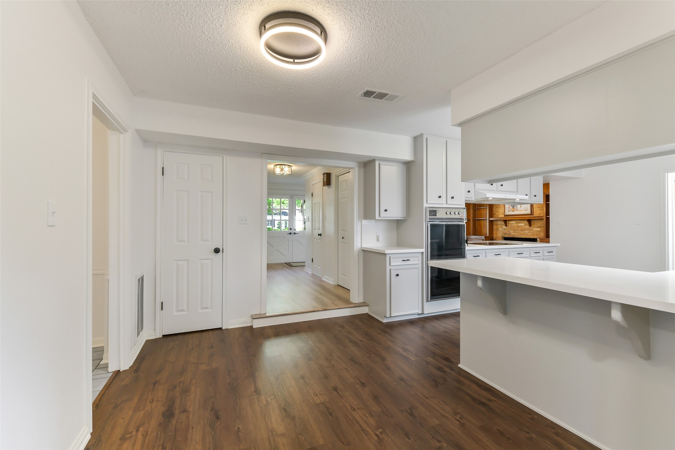 13103 Coral Ridge Court Houston, TX 77069 - Photo 6 of 43 a view of a kitchen with a sink and dishwasher wooden floor