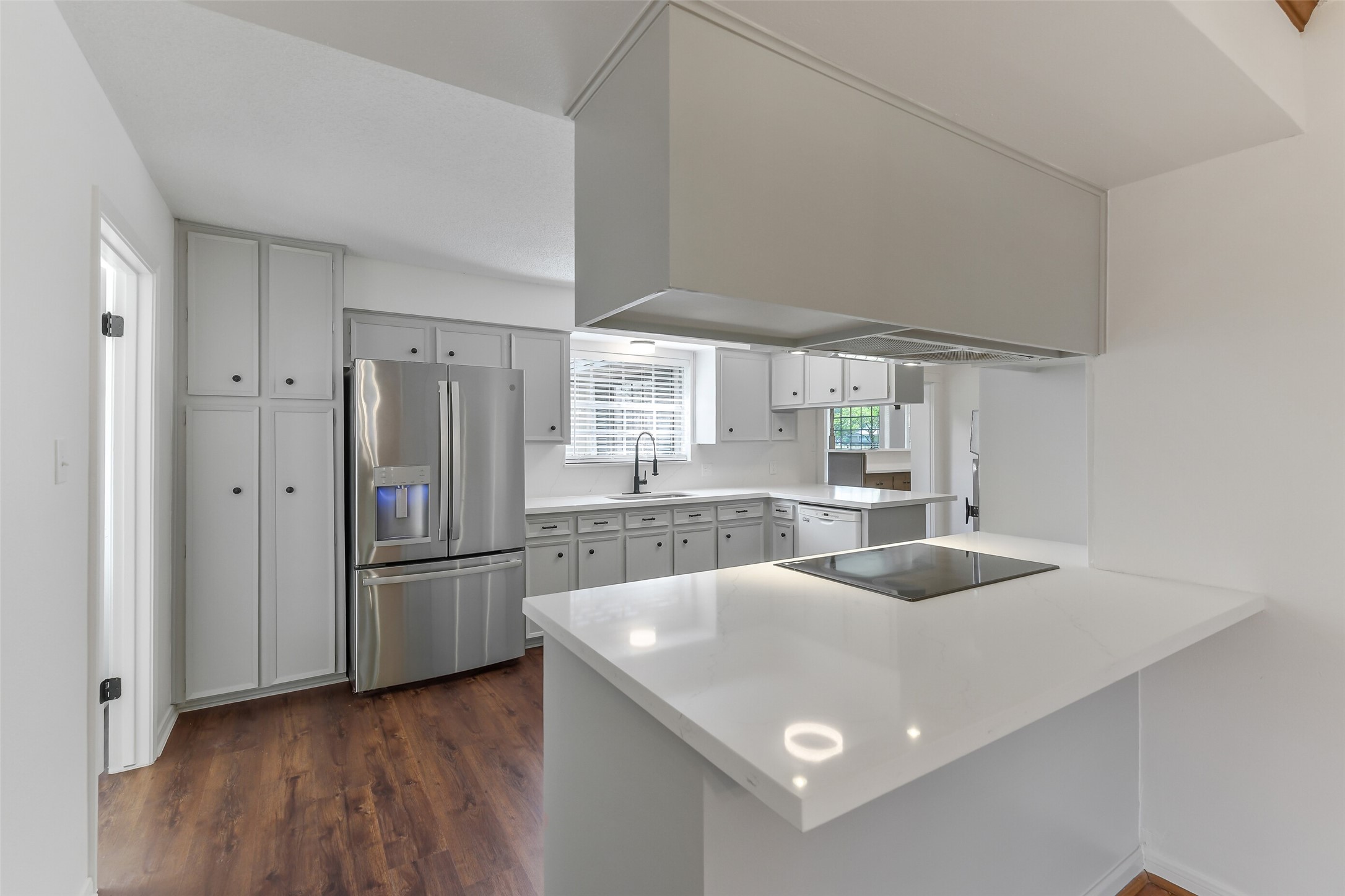 13103 Coral Ridge Court Houston, TX 77069 - Photo 9 of 43 a kitchen with stainless steel appliances granite countertop a sink and a refrigerator