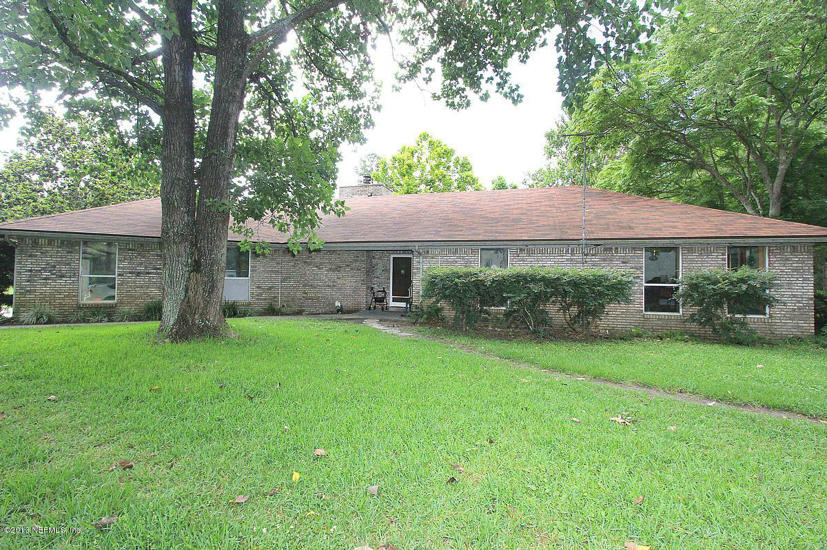 3098 I Pacetti Road St. Augustine, FL 32092 - Photo 1 of 21 a front view of a house with a yard