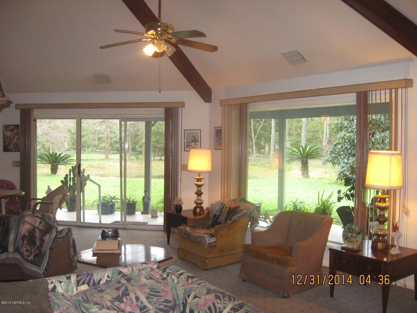 3098 I Pacetti Road St. Augustine, FL 32092 - Photo 19 of 21 a living room with furniture and a large window