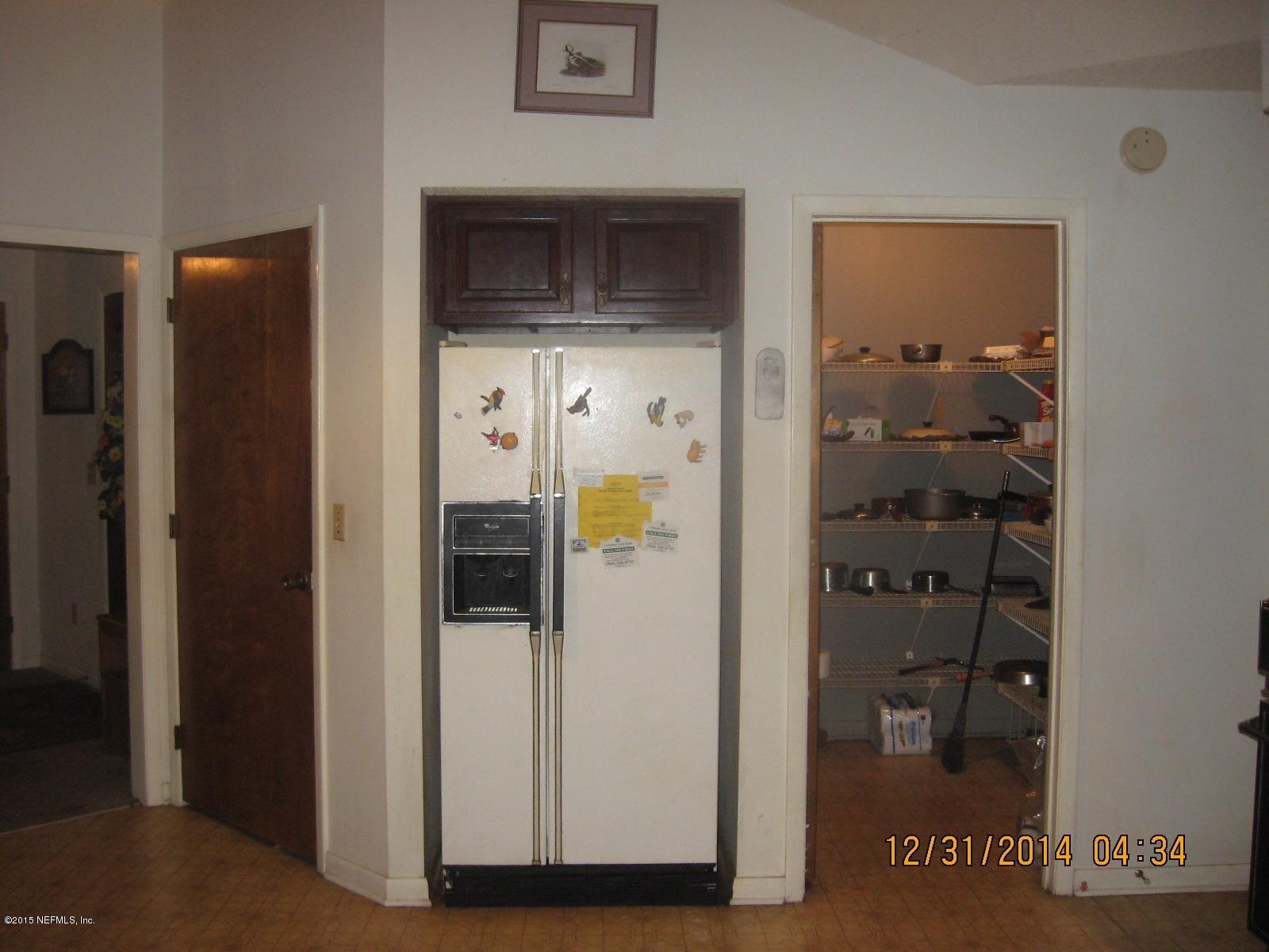 3098 I Pacetti Road St. Augustine, FL 32092 - Photo 21 of 21 a view of a hallway with wooden floor and living room
