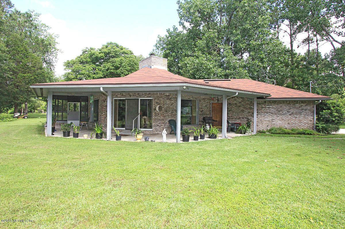 3098 I Pacetti Road St. Augustine, FL 32092 - Photo 3 of 21 front view of a house with a garden