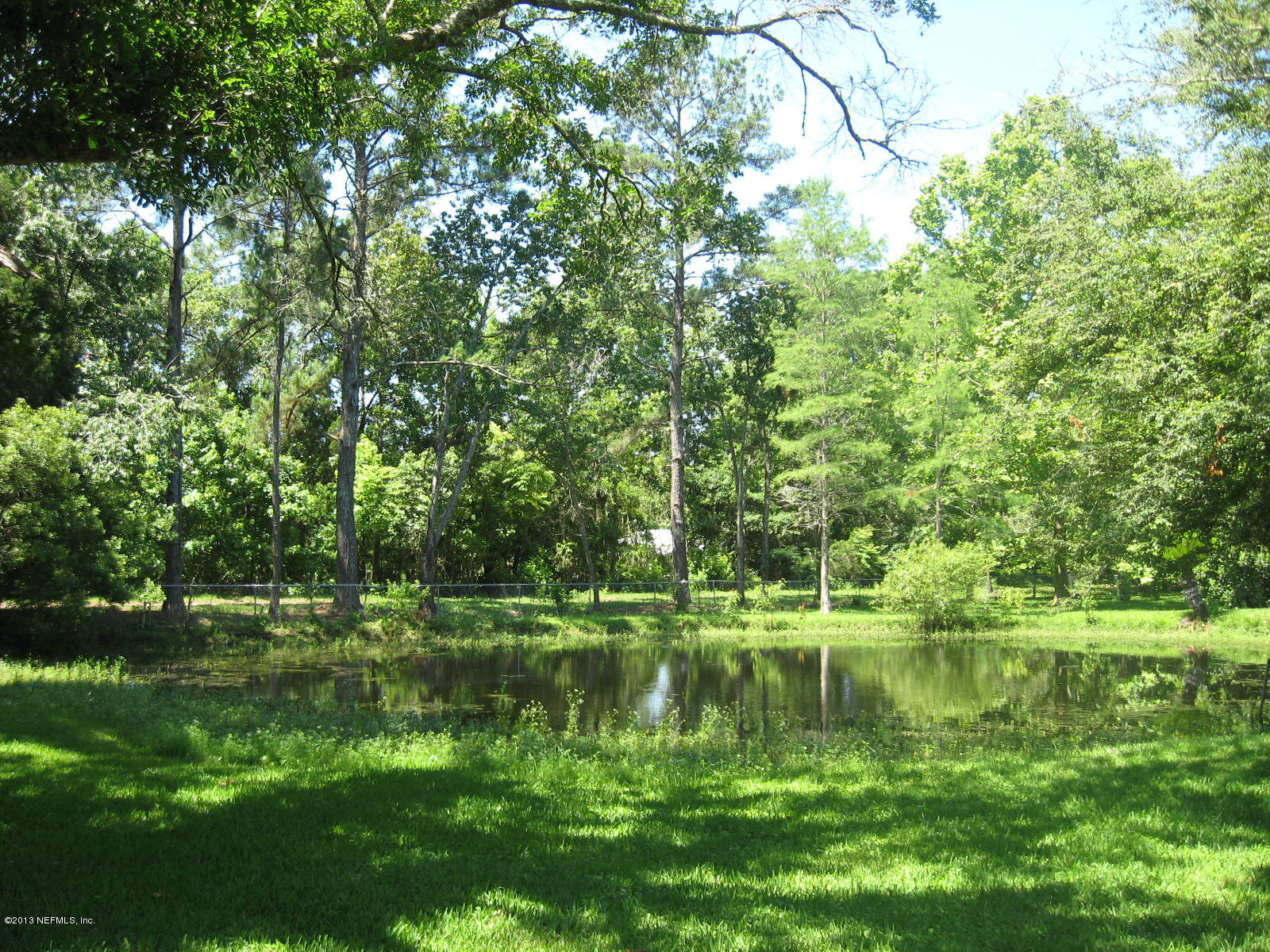 3098 I Pacetti Road St. Augustine, FL 32092 - Photo 5 of 21 a view of a lake with a yard