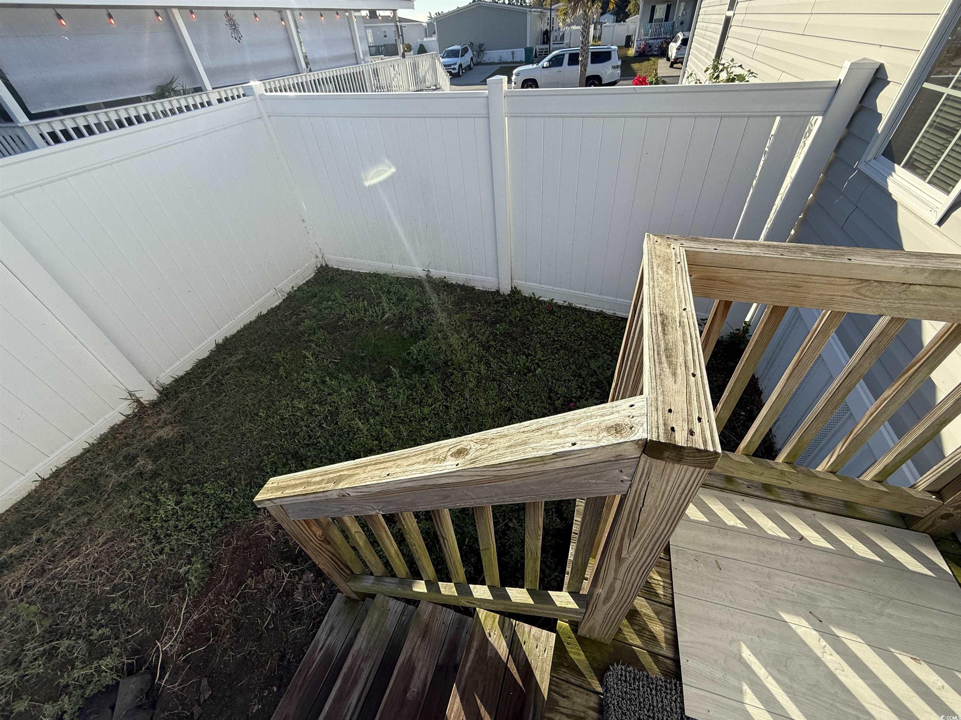 131 Shetland Woods Drive Myrtle Beach, SC 29577 - Photo 18 of 20 Fenced backyard featuring a wooden deck