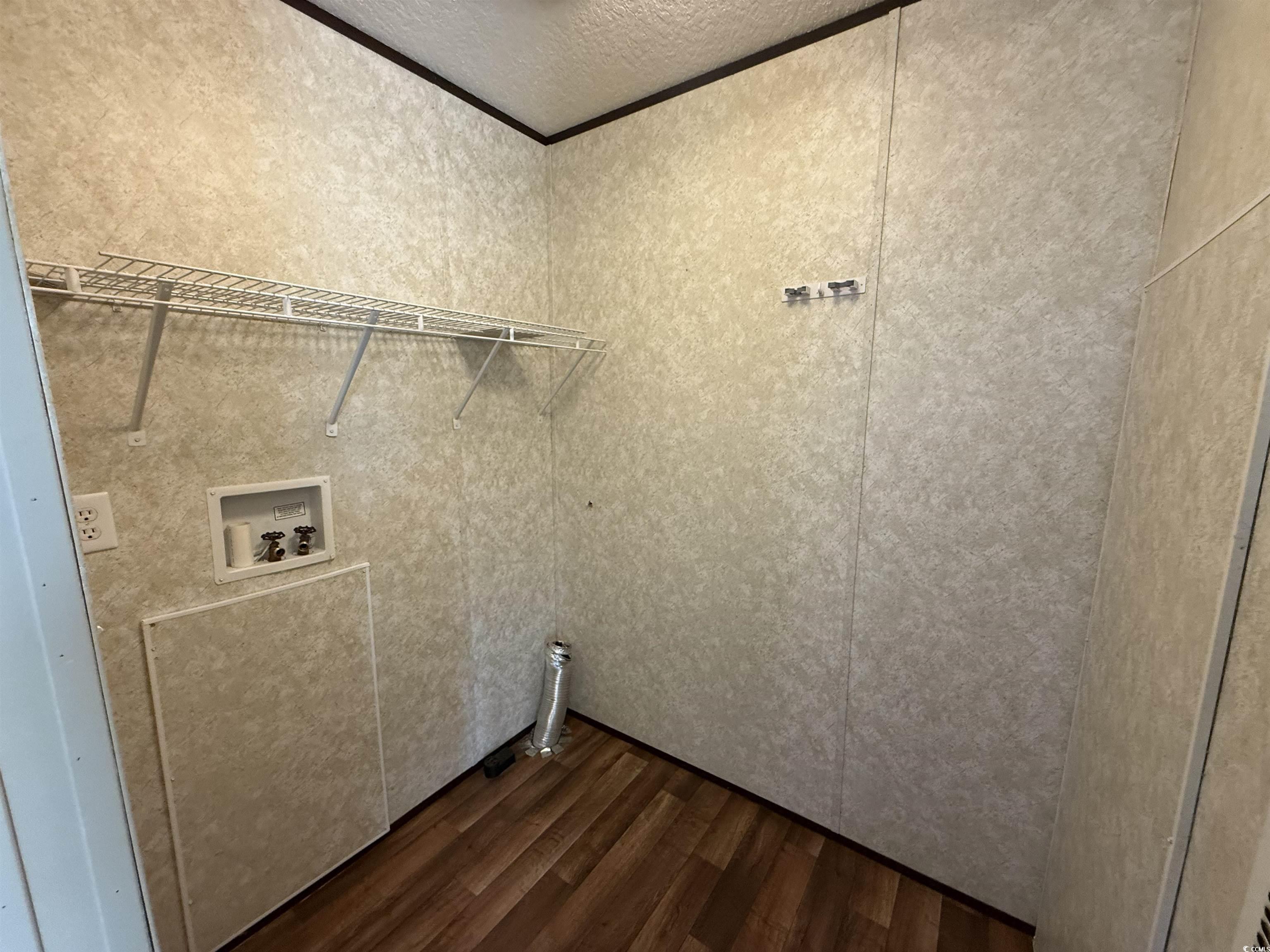 131 Shetland Woods Drive Myrtle Beach, SC 29577 - Photo 8 of 20 Laundry area with dark wood-type flooring, a textured ceiling, and washer hookup