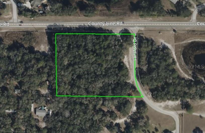 Countyline Road Spring Hill, FL 34606 - Photo 1 of 1 a view of a back yard